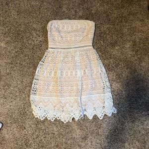 Small white strapless dress.